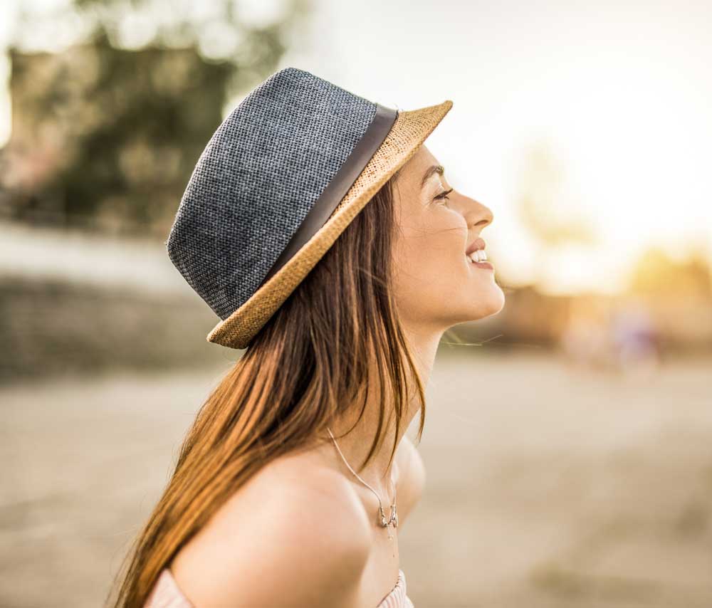 woman wearing a hat